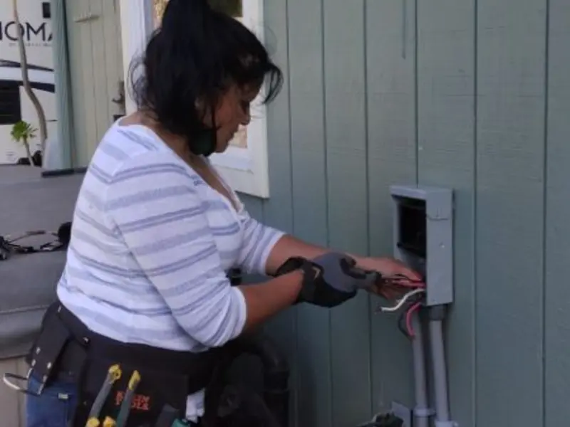 Licensed electrician wiring an exterior subpanel in Scottsboro
