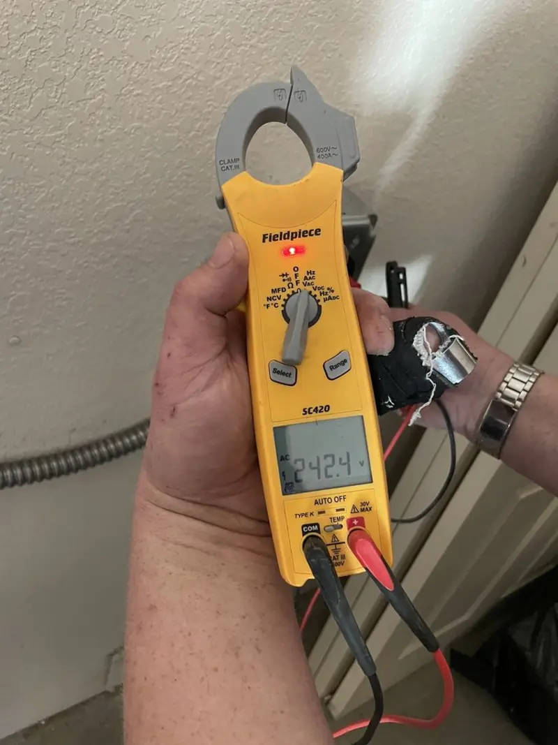 Voltage testing with clamp meter during Whole House Surge Protector in Scottsboro